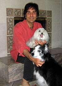 Gary Francione sitting with his two rescue dogs, Mollie and Katie