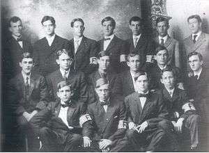 Team photo, with players in dress suits
