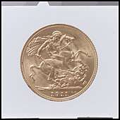 A gold coin dated 1911 with the design being St George and the Dragon