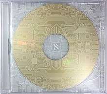 A jewel CD case with no artwork, covered by thin white lines, resembling a circuit board, with a white Hebrew letter Aleph in the middle of it. Inside is a gold disk with no text on it.