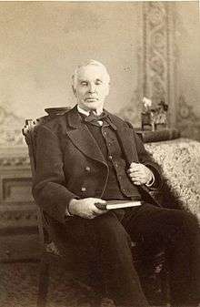 Photo of Elias Smith sitting in a chair