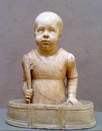 Sculpture of St. Cyricus as a bald toddler standing in a small tub and holding a palm branch