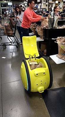 A Gita robot being packed with groceries at a Boston area supermarket.