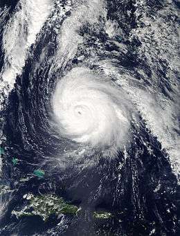 A visible satellite image of a well-organized hurricane at peak intensity on October 16.