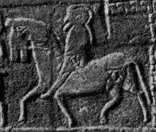 Black and white photograph of a mounted warrior inscribed upon a stone sarcophagus