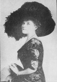 Image of profile of Grace Drayton, wearing a large feathered hat.