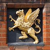 The Badge depicts a gold griffin on a black background