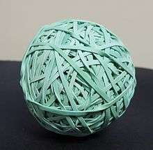 A rubber band ball made of over 300 rubber bands.