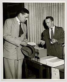 Photograph of Gregory Swanson consulting the Assistant Dean
