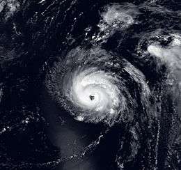 A satellite image of a strong hurricane, with the eye visible near the center of the picture