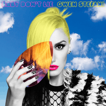 The cover showing Gwen Stefani in black and white, while her hair and the background is colored. She holds a colorful jewel up to her eye.