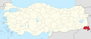 Hakkari highlighted in red on a beige political map of Turkeym