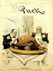 A political cartoon in color. Two caricatured gentlemen in suits sit at a table with large, exaggerated cutlery, a colossal turkey before them, marked "Presidency". The plate bears the words, "Sound money vote". "For what we are about to receive," says the man on the left, holding the carving knife with a look of deceitful intrigue, "May the Lord make us truly thankful."