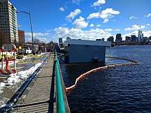 The Harvard Sailing Center in Cambridge, Massachusetts partially sinking into the Charles River during the Nor'easter.