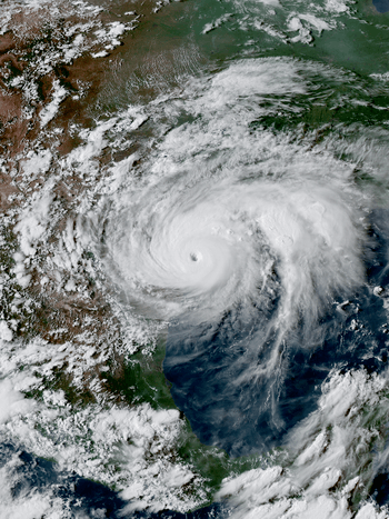 Satellite image of a powerful tropical cyclone nearing the coast of southern Texas, with an eye clearly visible