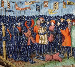 A crowned man in a crowd of armed men