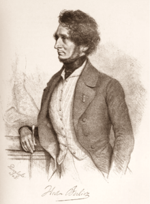 portrait of white man in early middle age, seen in left profile; he has bushy hair and a full beard but no moustache.