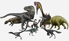 Reconstruction of several dinosaurs of various sizes and colors