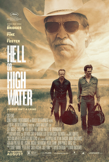 The top of the poster is filled with the face of an old man wearing a cowboy hat. Beneath two men walk across a harsh landscape hauling two large black duffel bags.