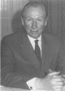 Black-and-white photograph of a man in a suit