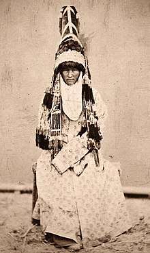 Old photo of a bride, completely covered except for her face
