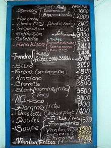 a list of meals and prices on a chalkboard