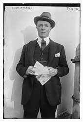 man in formal lounge suit and trilby hat