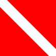 A red flag with white diagonal band