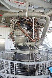The SSME is a compact tangle of pipework attached to a much larger rocket nozzle.