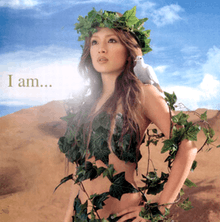 A body shot of a woman (Ayumi Hamasaki) wearing vines and leaves around her body, letting down her brown hair. As she looks towards a distance, a dove sits on her shoulder whilst standing in front of a desert-like surrounding. The title of the album is superimposed on the image.