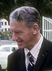 A photograph of Ian Smith. He is wearing a blue tie with white and red stripes.