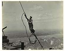 A photograph of a cable worker, taken by Lewis Hine as part of his project to document the Empire State Building's construction