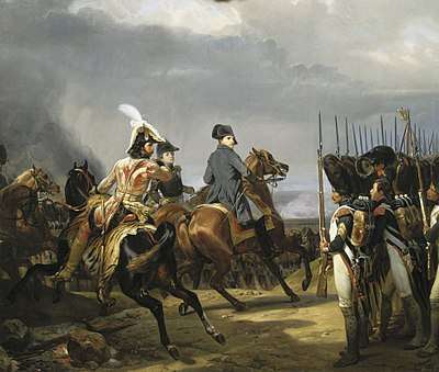 Napoleon on horseback, reviewing a rank of Imperial Guards in bearskin hats