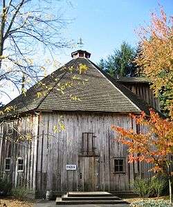 Front of an eight-sided wooden barn located on Imbrie Farm.
