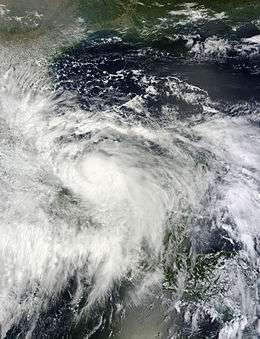 A visible satellite image of a tropical storm approaching hurricane intensity in the Bay of Campeche.
