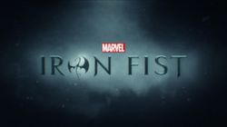 Iron Fist written in black writing, the letter O written in the form of a stylized dragon.