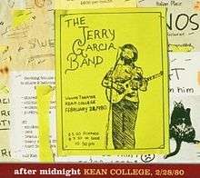 A flyer for the Jerry Garcia Band concert at Kean College, posted on a bulletin board