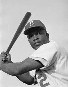 Jackie Robinson Wearing A Brooklyn Dodgers Baseball Cap