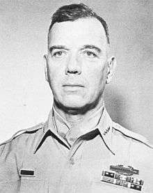 Head-and-shoulders photo of General James Van Fleet, 60 years of age, shown wearing khaki uniform blouse, four-star insignia and neckerchief.