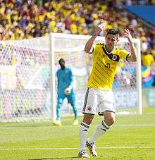 James Rodríguez with his arms high