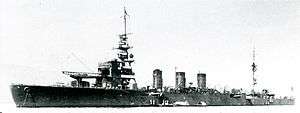 Black and white photograph of a World War II-era warship