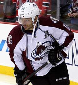 Iginla stares to his right as he stands on the ice surface during a pre-game warm-up.