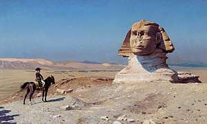 Painting of a man alone on a horse in front of the Great Sphinx in the midst of the desert.