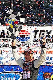 American racing driver Jeff Gordon celebrating a racing win at Texas Motor Speedway in 2009