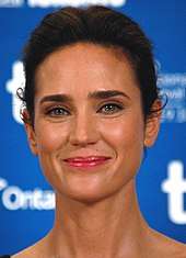 Jennifer Connelly—a white female with straight dark hair pulled back tightly around her head, hazel eyes, and smiling slightly—attending the 2010 Toronto International Film Festival at age 39.