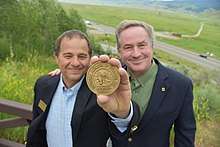 National Museum Wildlife Art Director Steve Seamons and National Geographic Photographer Joel Sartore pose with the Rungius Medal in June, 2017.