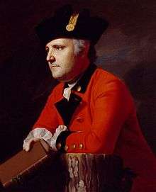 Painting of a determined-looking man in a red military coat with black lapels and a black hat