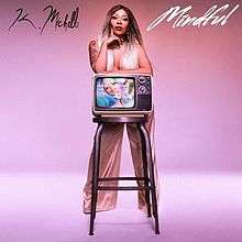 An image of K. Michelle standing in front of a stool with a television on top of it; the singer's name and single's title are also on the cover.