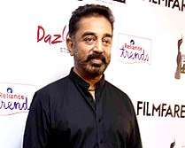 Kamal Haasan posing for the camera at the 62nd Filmfare Awards South ceremony