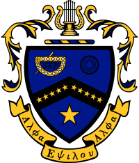 Coat of Arms of Kappa Kappa Psi. A blue shield is divided by a black chevron, on which ten gold stars are placed: five on the left side of the chevron, five on the right. On the upper-left side is a representation of the fraternity badge in gold and black. On the upper right are three black circles. In the lower half of the shield, there is a large gold star. The shield is capped by a bar of alternating blue and gold, over which rests a golden lyre. Decorative mantling of gold with blue surrounds the crest. Beneath the crest is a golden scroll, on which are written the Greek words "Alpha Epsilon Alpha."